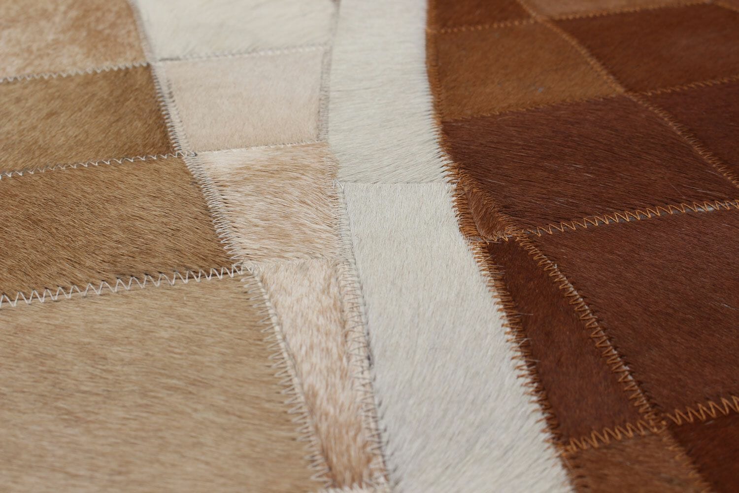 Lars koeienhuid rug beige